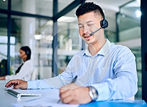 Man, writing notes and callcenter with telecom, communication and contact us with CRM. Happy working at telemarketing