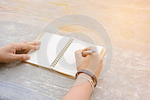 Man writing pen in book