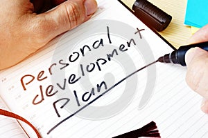 Man writing Personal development plan.