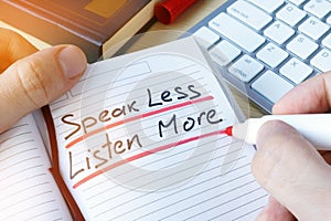 Man writing Speak less listen more. photo