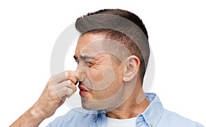 Man wrying of unpleasant smell photo