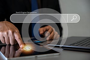 Man's hands using tablet computer for SEO and website optimization