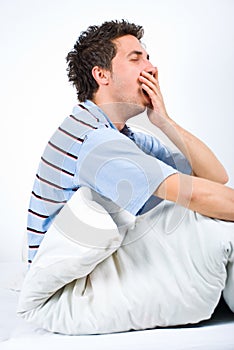 Man yawning and preparing for sleep