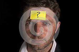Man with yellow postit note on his forehead