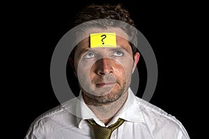 Man with yellow postit note on his forehead