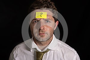 Man with yellow postit note on his forehead
