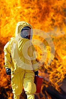 Man with a yellow protective suit against fire