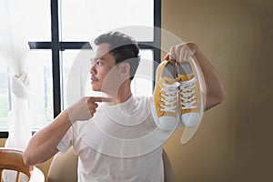 A man and yellow sneakers