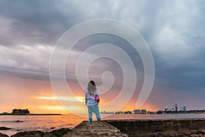 Man with Yoga Mat at sunset