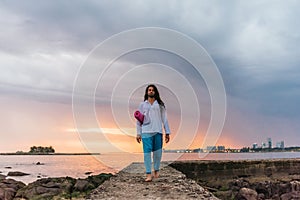 Man with Yoga Mat at sunset