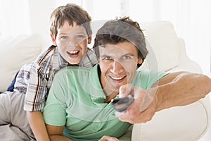 Man and young boy with remote control