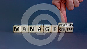 Manage stress and be health symbol. Doctor turns cubes and changes words `manage stress` to `manage health`. Beautiful grey