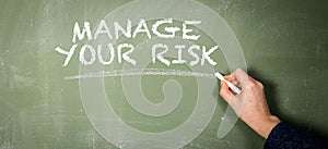 Manage Your Risk. Text on a green chalkboard