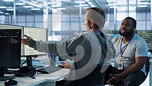 Manager admonishing programmer after making error in data center