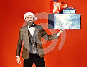 Manager with beard and pile of Christmas gifts