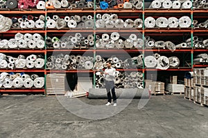 Manager checking stock with his tablet on a warehouse floor