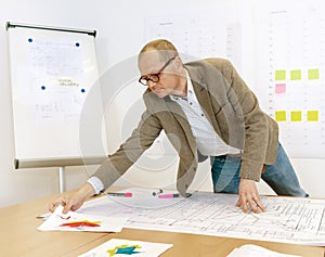 Manager Checking Technical Drawings