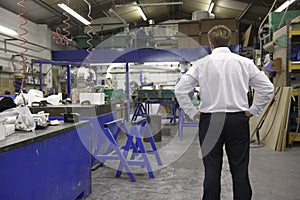 Manager on factory floor