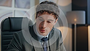 Manager hands typing laptop keyboard sitting desk closeup. Serious man working