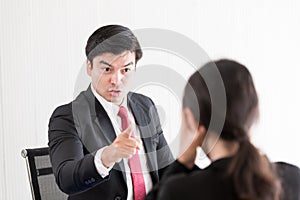 The manager has upset to employee woman with anger and unhappiness