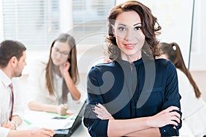 Manager with her team working in the office