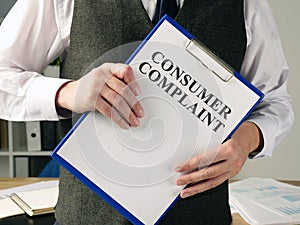Manager is holding consumer complaint application photo
