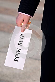 Manager holding a job termination notice Pink Slip