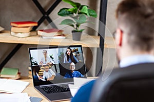 Manager holding video conference with colleagues