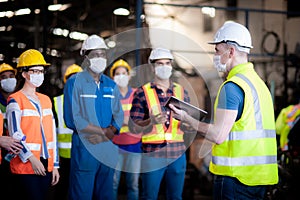 The manager or leader team is assignmenting a job for team of technicians, supervisor, foreman and engineers In the morning meetin