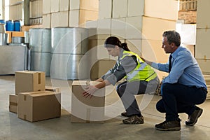 Manager motivating female worker while working