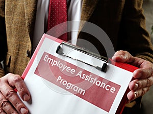 Manager offers Employee Assistance Program EAP papers.