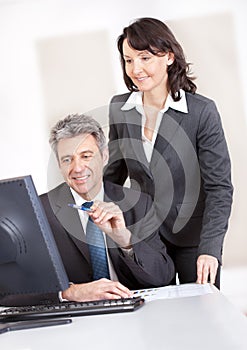 Manager overseeing businessman