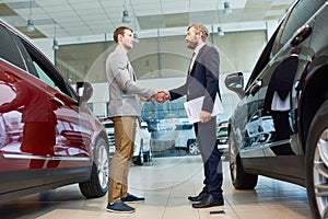 Manager Selling Cars in Showroom