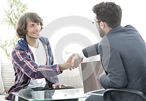 Manager shakes hands with his client