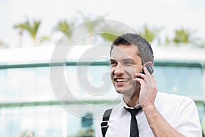 Manager speak on phone across office