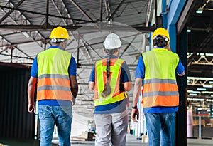 Manager and supervisor taking inventory in warehouse, Foreperson making plans with warehousemen, Workers team working in warehouse