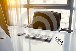 Manager Table with Desktop Computer and eye glasses