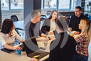 Manager talking to his staff at the office meeting photo