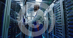 Manager and technician working in a data center