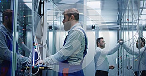 Manager and technician working in a data center