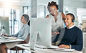 Manager training call center agent on computer with talking, discussing and negotiating deals, sales and promotions for
