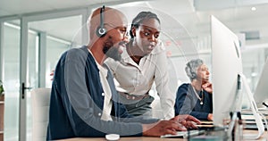 Manager, training and man in call center office learning with mentor for advice in technical support on computer