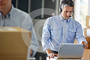 Manager Using Headset In Distribution Warehouse