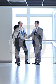 Manager welcomes the client in the lobby office