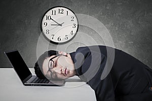 Manager work overtime and sleep on laptop