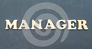 Manager written on a black background.