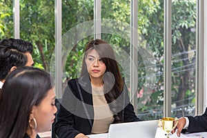 Managers are stressed in the work of the team. Young female does