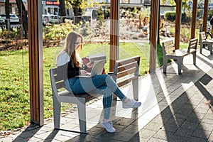 Managing Stress in High School. Stressed and tired student girl with laptop outdoors. Difficult exam, trouble, remote