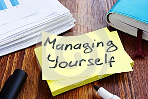 Managing yourself. Office table with papers. Self management.