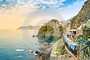 Manarola, Cinque Terre - train station in famous village with colorful houses on cliff over sea in Cinque Terre